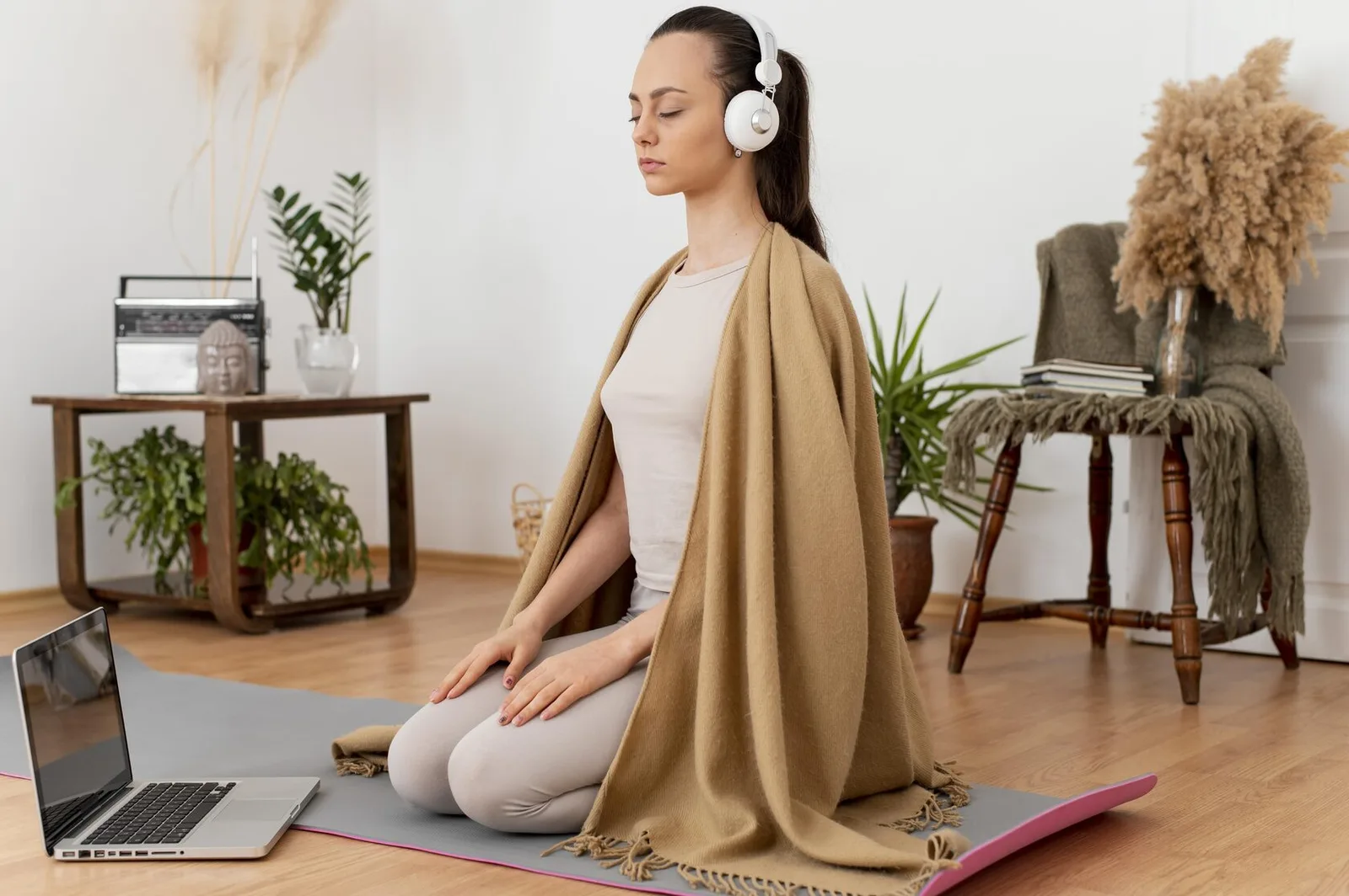 A woman meditating at home