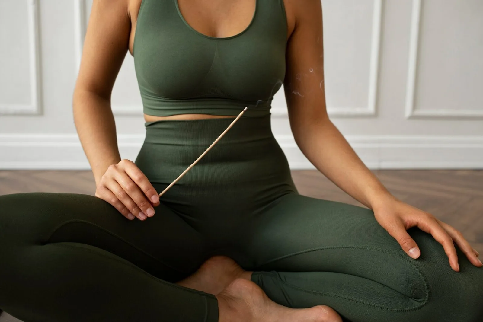 A woman practising with a yoga mat